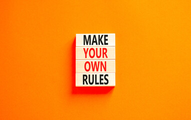 Make your own rules symbol. Concept words Make your own rules on wooden cubes. Beautiful orange...