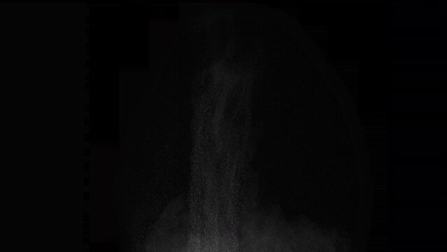 Projectile Impact on the Snow Cover. A column of soil and dust rises into the air from the explosion. Isolated on black. Use in blend modes to simulate a battlefield