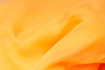 Obraz premium orange silk. wavy fabric for background