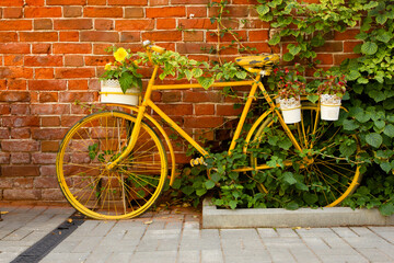 Fototapeta na wymiar old retro bike on the background brick wall.