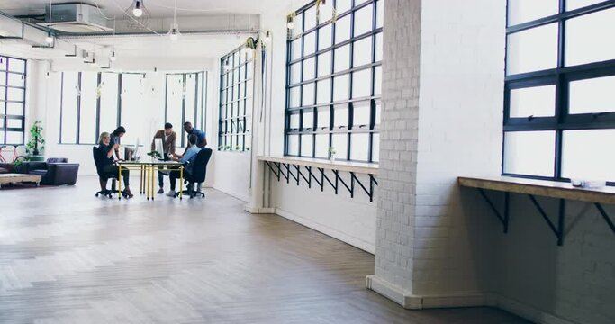 Teamwork, collaboration and business people in a meeting, planning and working on creative marketing partnership. Strategy, corporate and employees talking about a project in an open space workplace