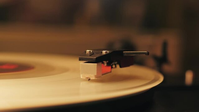 White Color LP Vinyl Disc Record Close-up Playing Music, Vintage old Vinil Player black phonograph spinning. Retro music player.