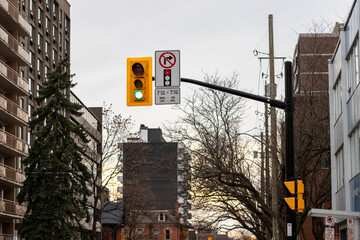 Traffic light in street with buildings in downtown district of Ottawa, Canada
