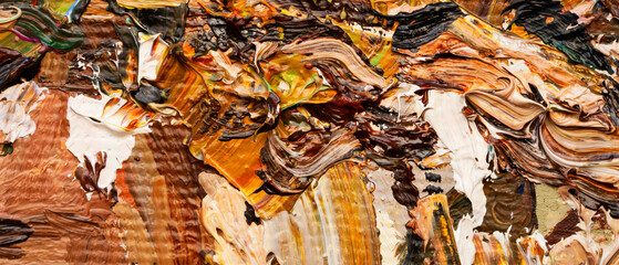 Macro. Abstract art. Expressive embossed pasty oil paints and reliefs. Colors: yellow, white, ocher, brown, green.