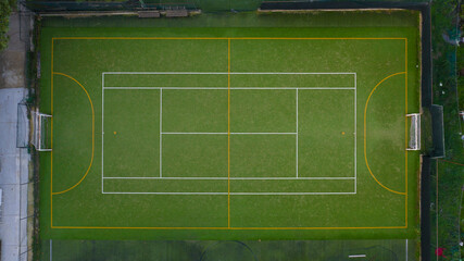 Perpendicular aerial view of a five-a-side football field in synthetic grass.