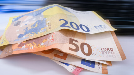Euro currency banknotes background. European paper money backdrop with 100, 200 and 500 euros bills.