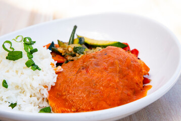 Healthy salmon in pureed sofrito sauce
