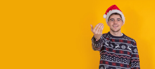 isolated young man with christmas clothes