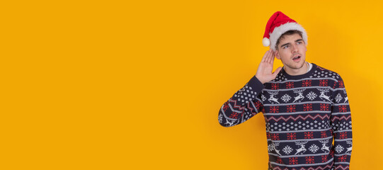 isolated young man with christmas clothes