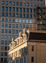 Detailed architecture of a historic building at golden hour in downtown Milwaukee, Wisconsin, USA - obrazy, fototapety, plakaty