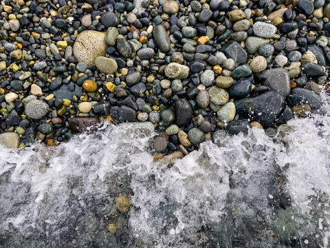 enormous activity of sea stones and waves on the beach