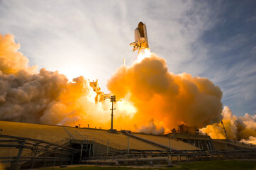Rocket laughing into space from Cape Canaveral, FL. Spacecraft launch. Smoke and steam shown. The...