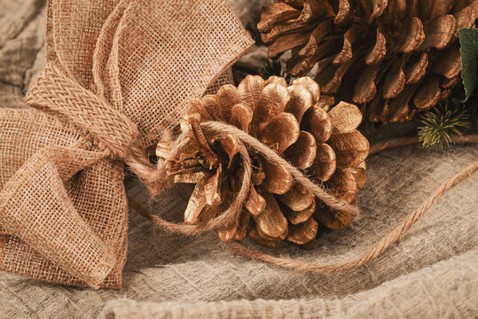 Zero waste Christmas concept. Fir cones and jute burlap decor, natural materials. Holiday concept