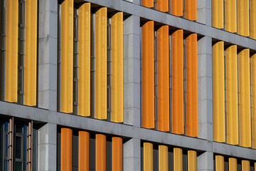 Abstract background of modern building wall with yellow and orange elements