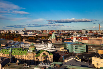 Fototapeta na wymiar Aerial scenic panoramic view city of Helsinki, capital of Finland with buildings at blue evening sky. Background of amazing urban scenery view of Scandinavian finnish architecture. Copy text space