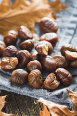 Peeled chestnuts. Sweet roasted chestnuts on cutting board.