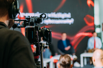Public Live Event. Television cameras at an IT seminar