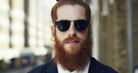 City, hipster and face portrait of man with travel sunglasses and ginger beard in France. Urban, assertive and trendy person with edgy fashion and natural freckles exploring or commuting.