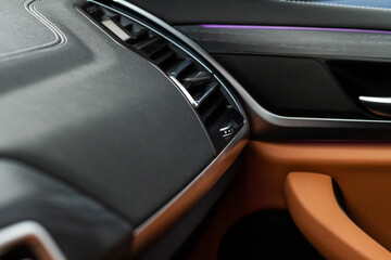Fototapeta premium Car air conditioning close up view. The air conditioner flow inside the car. Detail interior of car. Air ducts.