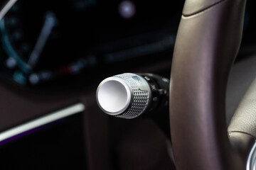Turn signal lever close up. Modern car  interior details. Car wipers switch control