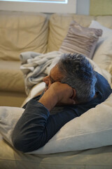 person sleeping on the couch brown older big man sleeping on sofa, retired businessman man sleeping on sofa watching tv mature older retired ethnic male grey hair sleepy Sunday resting watching movies