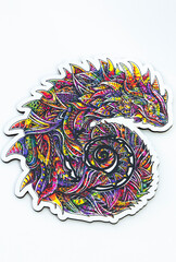 Fototapeta premium wooden puzzle figurine in the form of an iguana. Logic game for adults and children. top view