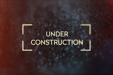 Under construction title, grunge style with grain and partial blur. Black and yellow color scheme with lens flare. - 548867577