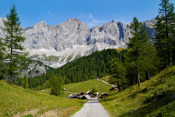 hiking trail leading to the alpine village Neustatt-Alm or Neustattalm (Neustatt valley) in the Austrian Alps by the foot of Dachstein mountain in Steiermark (Schladming-Dachstein, Austria)