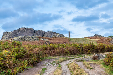 Fototapeta na wymiar A view towards Precambrian rock outcrops and the war memorial in Bradgate Park, Leicestershire, UK, in Autumn