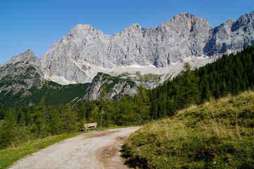 a hiking trail leading through the picturesque alpine landscape by the foot of Dachstein mountain in the Austrian Alps of the Schladming-Dachstein region (Steiermark or Styria, Austria)