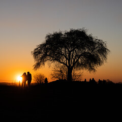 Fototapeta na wymiar Couple silhouette in sunset time