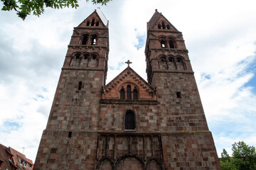 Fototapeta premium Church with two towers in a French village in the Alsace area