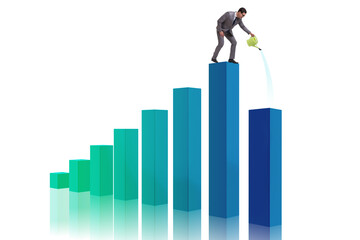 Businessman in investment growth concept with watering can