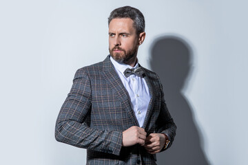 unshaven tuxedo guy in studio. photo of guy wearing tuxedo. guy wear tuxedo formal suit.