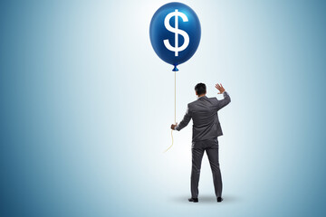 Businessman with dollar balloon concept