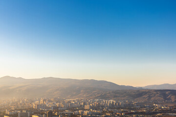 top view of the city at the foot of the mountain