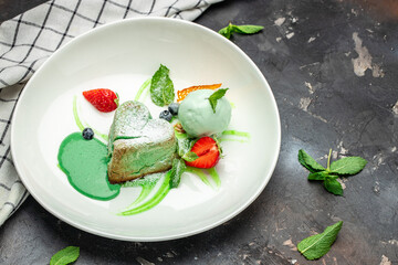 pistachio fondant dessert on a dark background, banner, menu, recipe place for text, top view