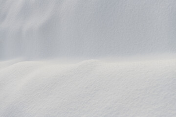 White snowdrift. Snow texture. Snowy whiteness. Abstact winter background, copy space