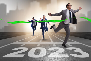 Businessman running to new 2023 year