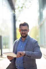 Classical portrait of businessman with tablet