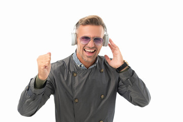 Excited man celebrating with music making winning gesture, music