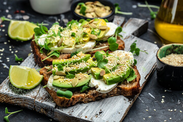avocado toasts with rye bread, Delicious breakfast or snack, Clean eating, dieting, vegan food concept. top view