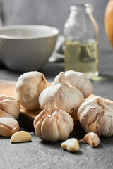 Whole garlic with peel, organic product, garlic cloves on a table. healthy gastronomy concept
