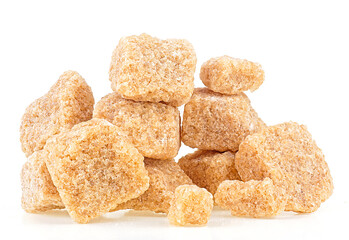 Brown cane sugar pieces isolated on a white background. Unrefined demerara.