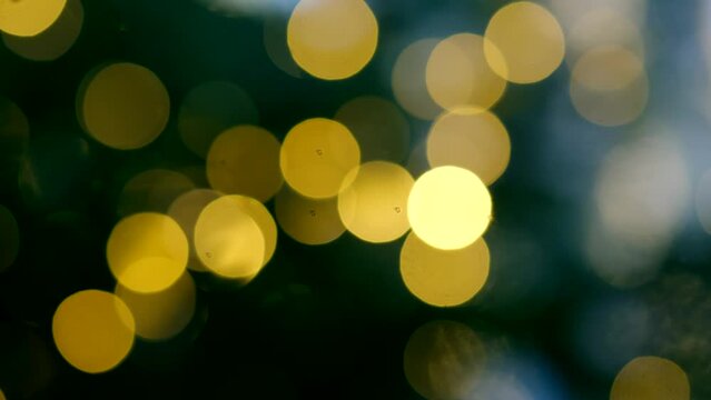Golden blurry christmas balls with beautiful bokeh background