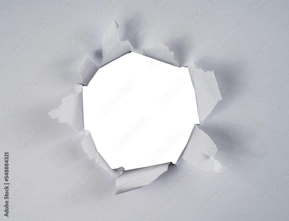 Aufkleber Torn paper with the curled ripped sides. a round black hole of torn on the white paper. realistic torn paper with the ripped edges for copy space and text.