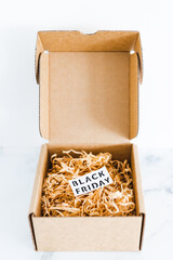 promotions and shopping deals over the festive season, parcel or gift box with Black friday label inside of it