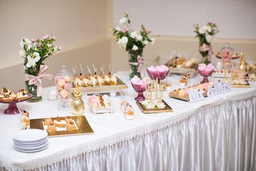 beautifully decorated table with sweet candy bar