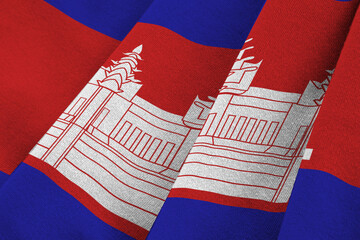 Cambodia flag with big folds waving close up under the studio light indoors. The official symbols...