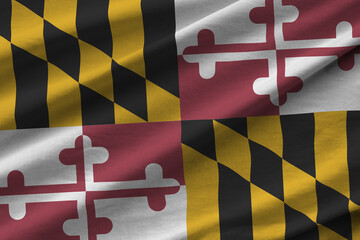 Maryland US state flag with big folds waving close up under the studio light indoors. The official...